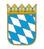 Wappen des Freistaats Bayern mit blau-weißen Rauten und goldener Krone.
